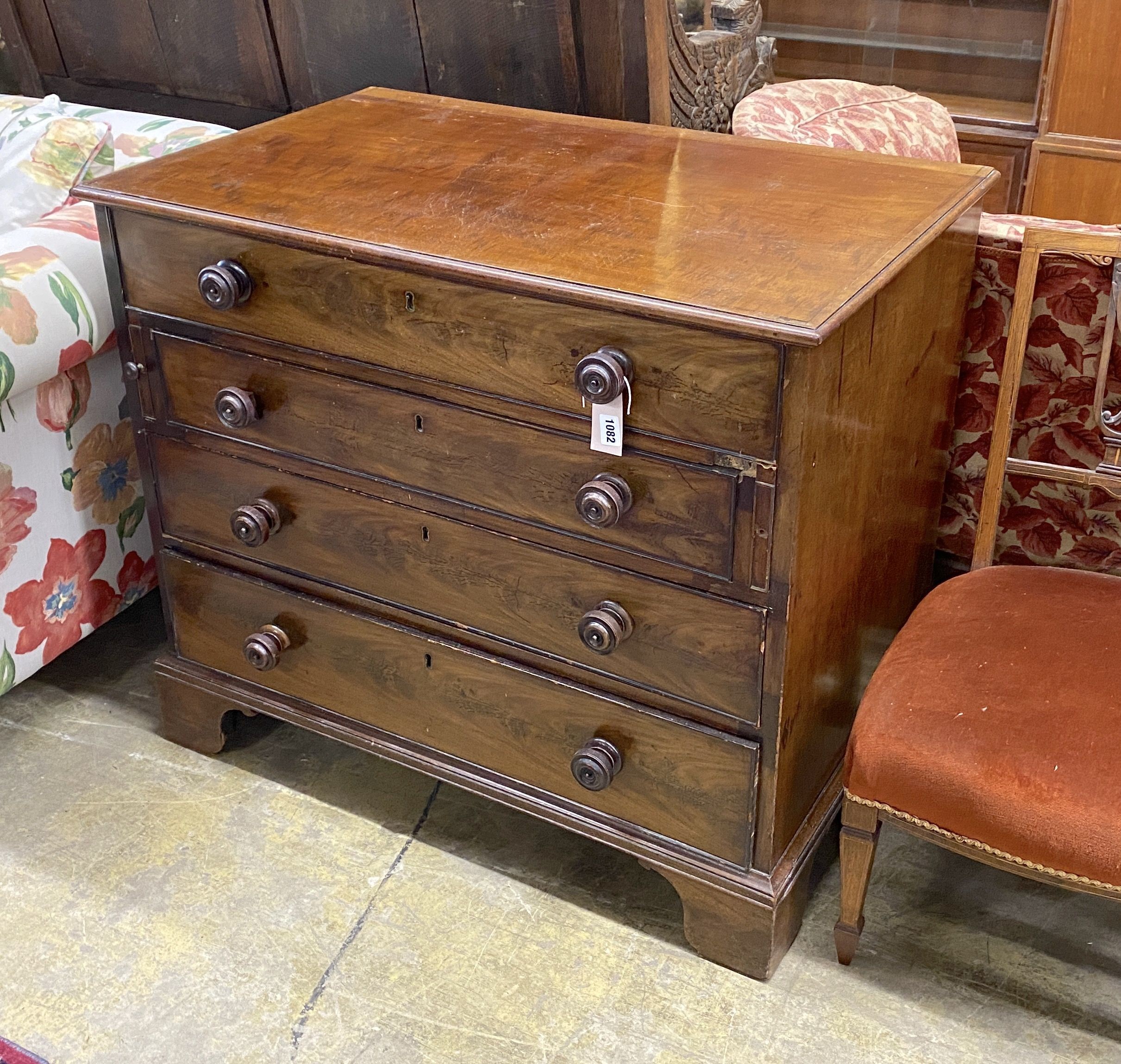 A George III mahogany dressing chest, with a fitted top drawer and later handles, width 91cm, depth 56cm, height 79cm